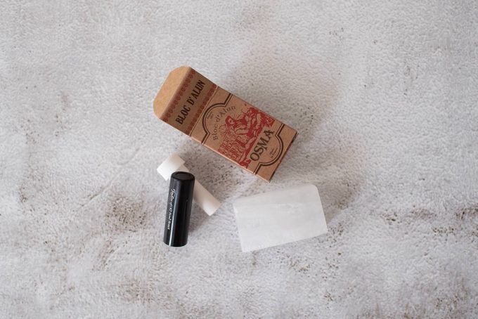 Osma alum block in its packaging alongside a Taylor of Old Bond Street shaving cream stick